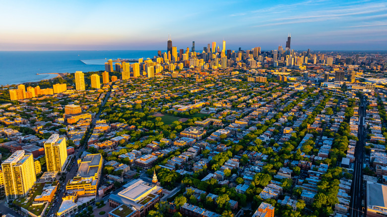 An aerial view of Chicago, with skyscrapers and Lake Michigan in the distance