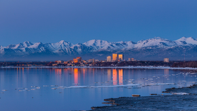 The skyline of Anchorage against the Chugach Mountains
