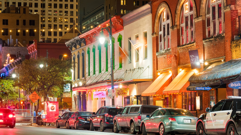 A downtown street in Austin, Texas, at night