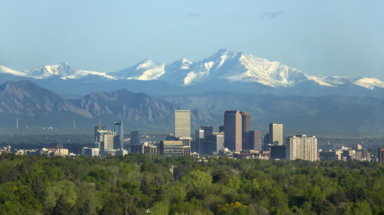 Denver skyline with mountains behind it
