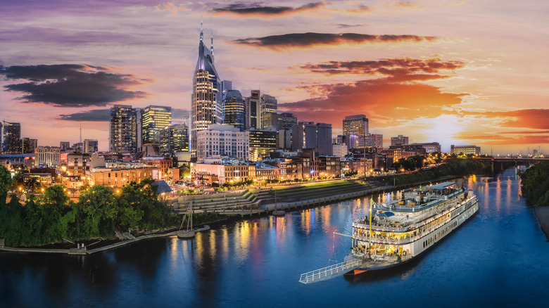 The city skyline lit up at sunset in Nashville, Tennessee