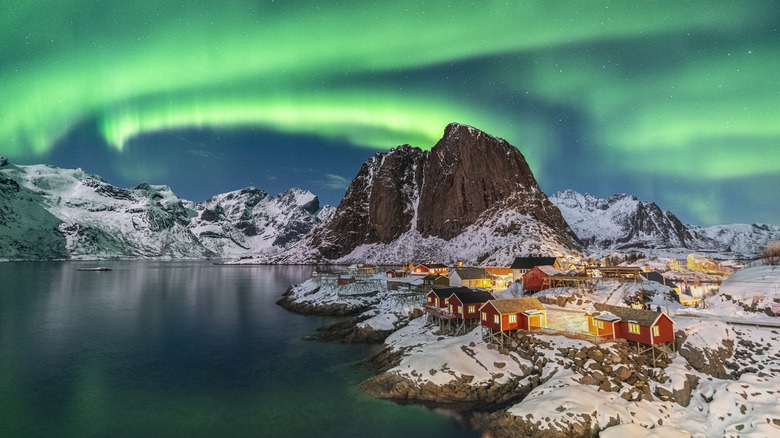 Cabins under Northern Lights in Norway