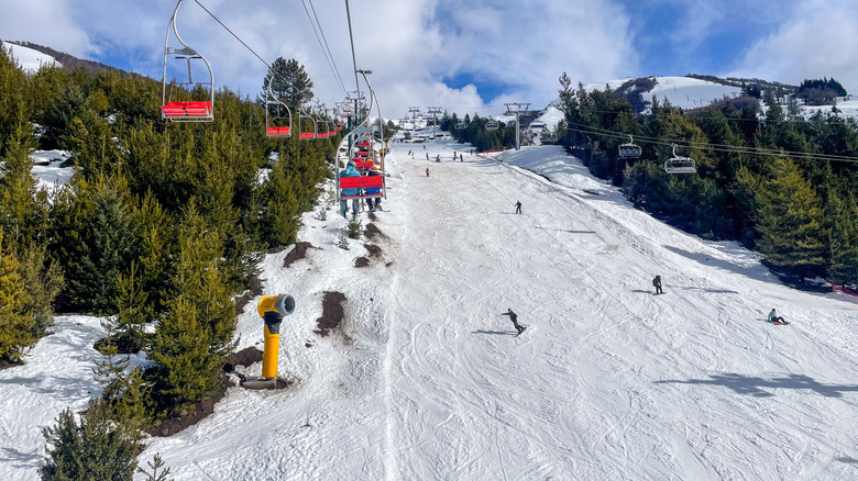 Skiers going down the hill at Catedral ski resort in Argentina
