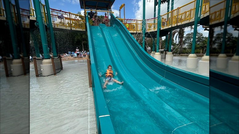 Child going down a slide at Adventure Island Water Park in Florida