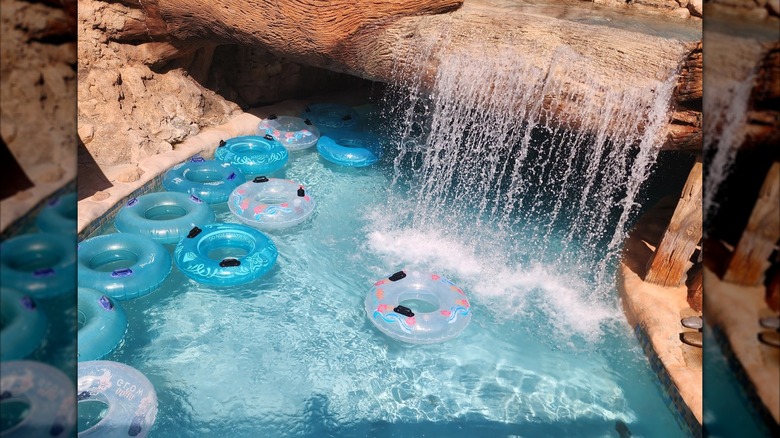 Tubes under a waterfall at Aquatica in Orlando