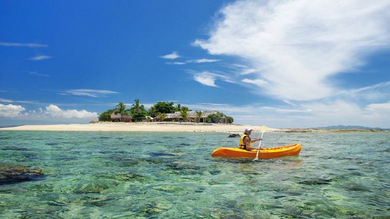 Woman kayaking in Mamanucas Islands, Fiji