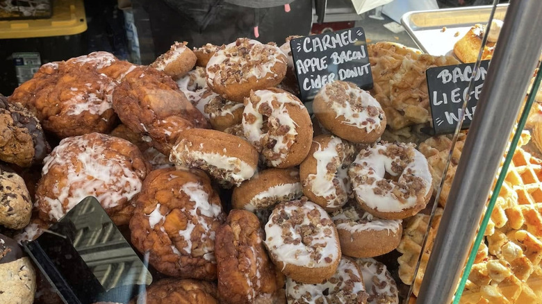 a pile of doughnuts with bacon at PA Bacon Fest