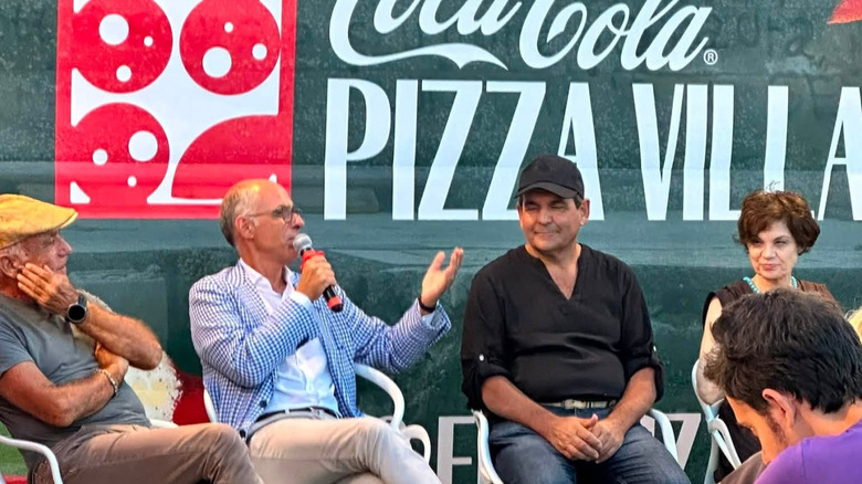 Discussion at Pizza Village in Pozzuoli, near Naples, Italy