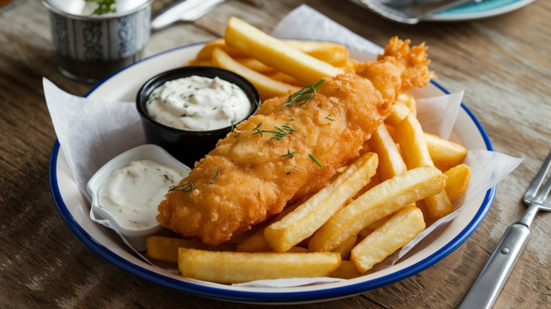 Fried fish with french fries, creamy coleslaw, and tartar sauce