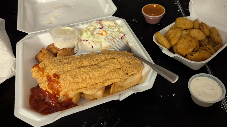 Fried catfish with coleslaw, hushpuppies, and fried pickles from Blalock Seafood Restaurant in Wichita, Kanas