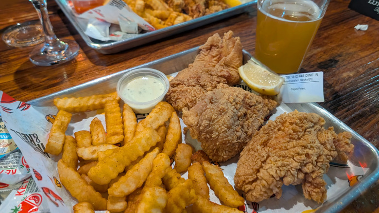 Fried catfish with fries from Hook & Reel Cajun Seafood & Bar in Maryland