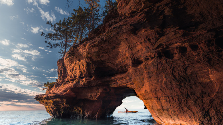 A kayaker exiting a sea cave on Apostle Island National Lakeshore