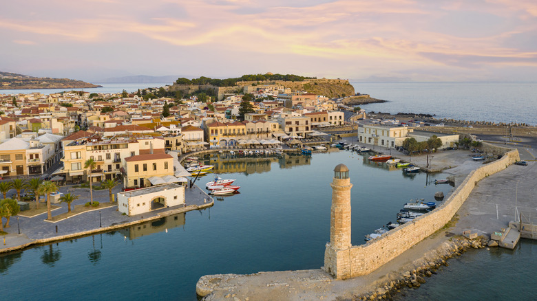View of Crete village with ancient lighthouse in foreground