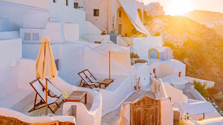 Deck chairs at at sunset on balconies on Greek coast