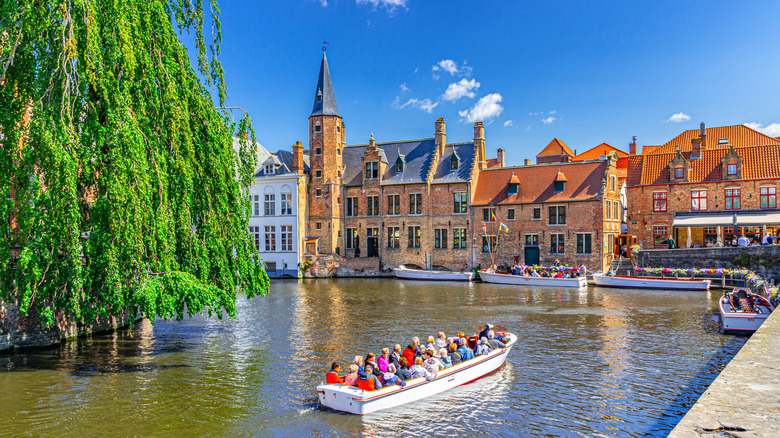 A tour boat along the canals of Bruges Belgium