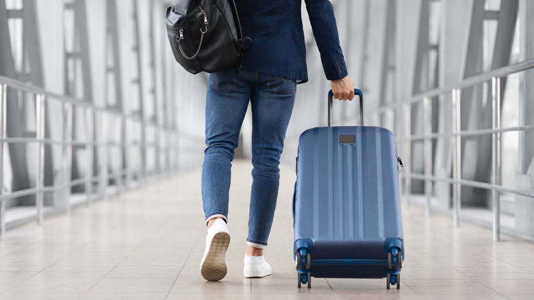 Traveler with their carry-on luggage