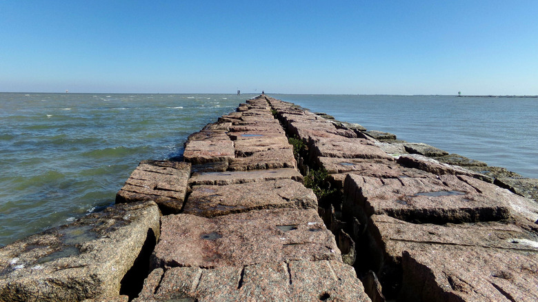 Port O'Connor's jetty surrounded by water in the Gulf of Mexico of