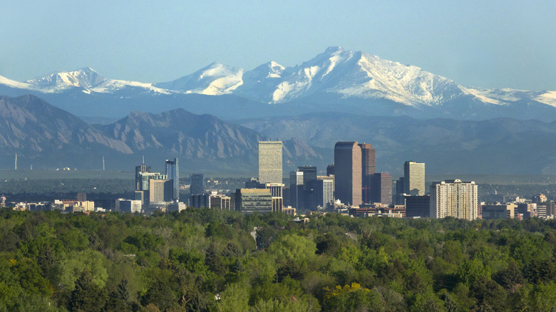 Denver skyline with mountains behind it