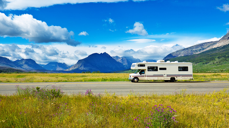 Recreatvional vehicle driving in front of Glacier National Park, Montana