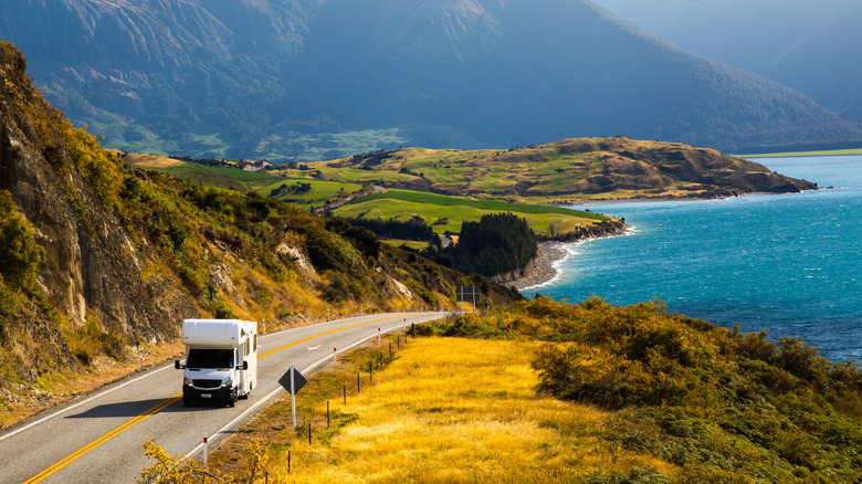 An RV driving along a lonely road.