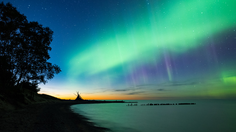 Green lights in the night sky from the Aurora Borealis above Lake Superior