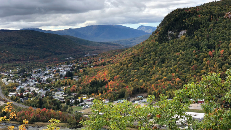 Berlin, New Hampshire sits at the valley of the White Mountains as surrounding trees begin to change color