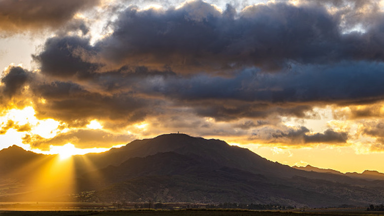 The sun setting behind Mount Ka'ala in Hawaii