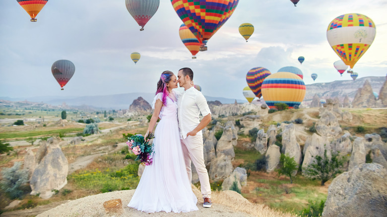 Wedding couple with hot air balloons, Cappadocia