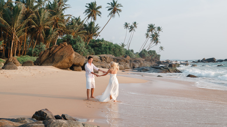 Bridal couple on the beach in Sri Lanka
