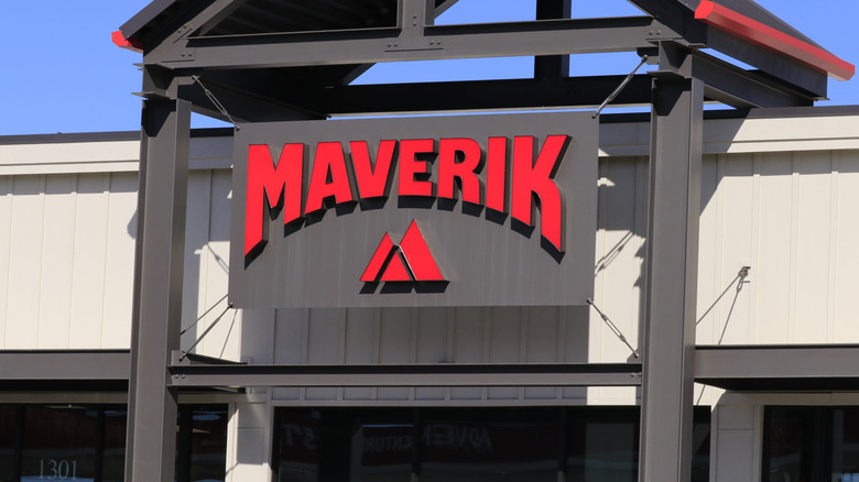 A Maverik sign on a building with blue sky in Laramie, Wyoming
