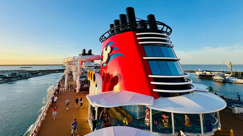 View of Disney Treasure deck with signature red funnel and Disney Cruise Line logo
