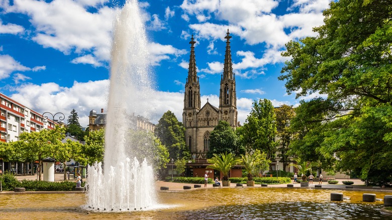 A fountain in front of historic buildings of Baden-Baden, Germany
