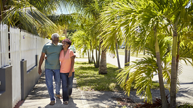 A couple with palm trees
