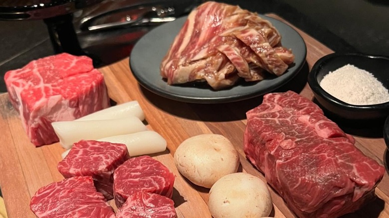 Raw cuts of meat resting at Cote Korean Steakhouse in Miami, Florida