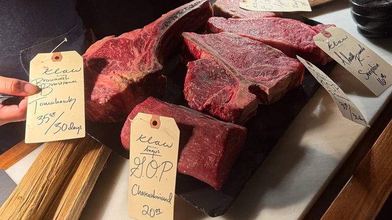Price tags on raw cuts of steak at Klaw Miami restaurant in Florida