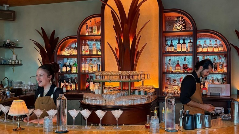 Two servers behind bar at Sunny's steakhouse in Miami, Florida
