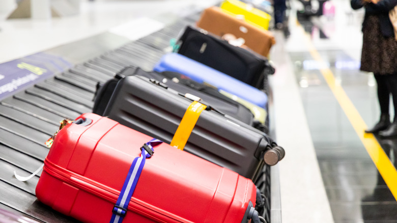 Baggage on a luggage carousel at an airport