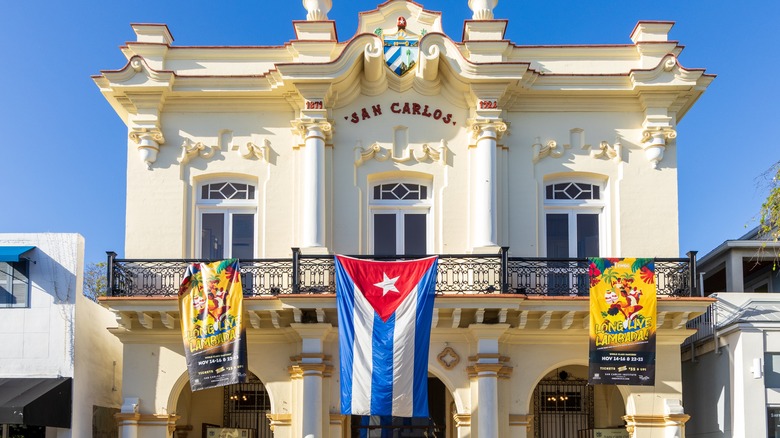 Cuban flag hanging on outside of San Carlos Institute