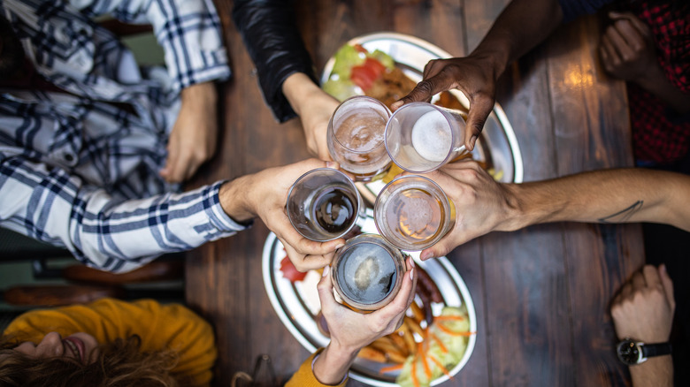 Friends toasting with alcoholic drinks
