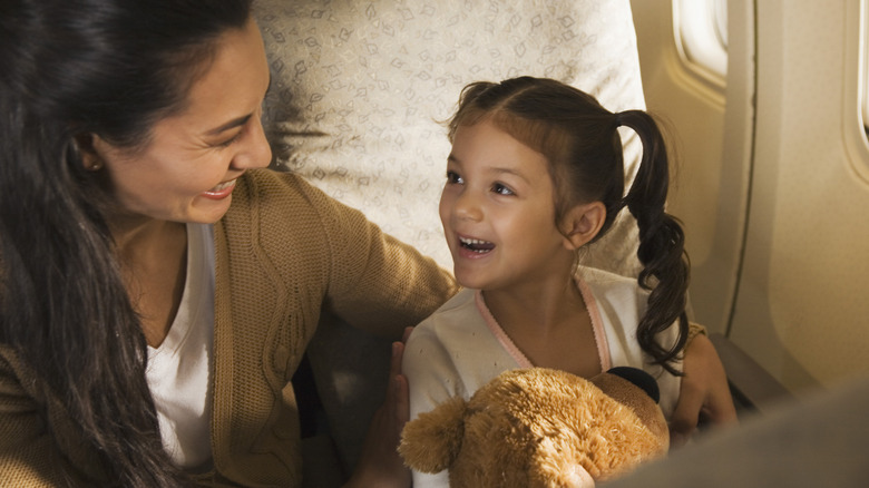 Mom and daughter on plane