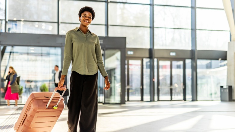 Woman walking confidently in an airport