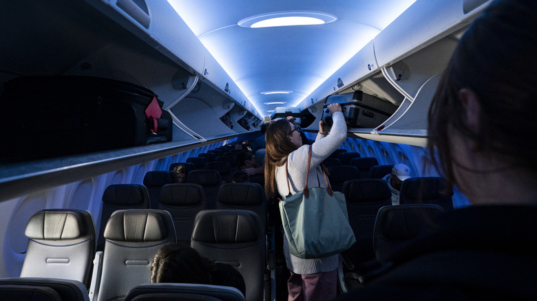 passengers board a JetBlue plane
