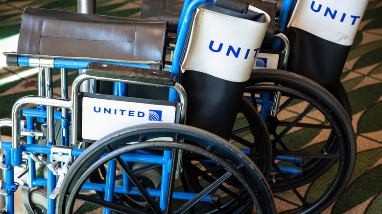 a stack of United Airlines wheelchairs