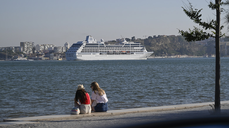Passengers sitting by the port