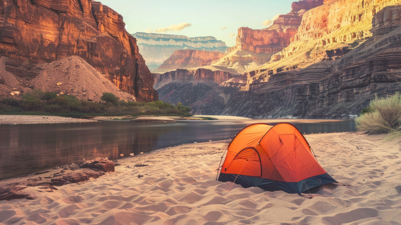 solo tent beside canyon river