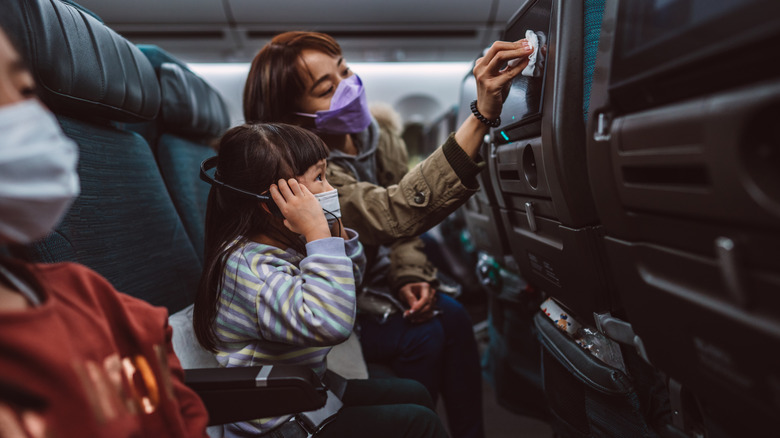 A mother wiping down her monitor