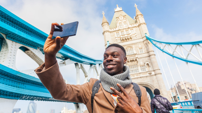 Man snapping selfie at Tower Bridge