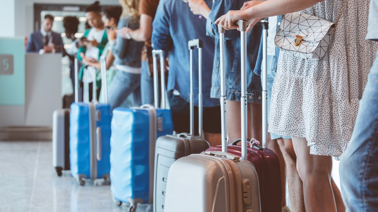Passengers waiting to board at a gate
