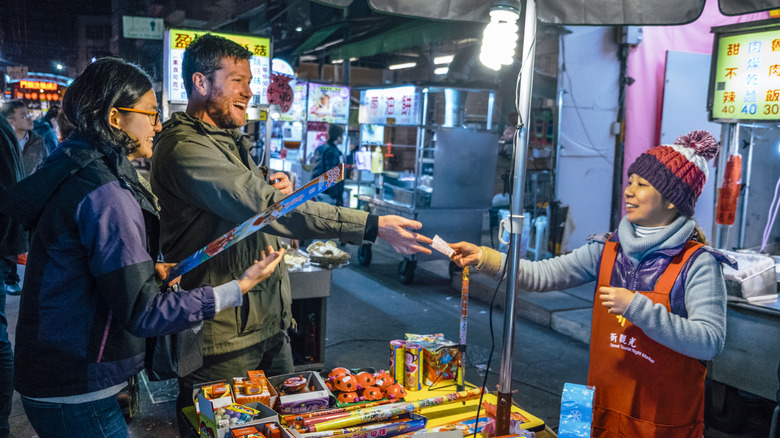 A couple shopping at a night market