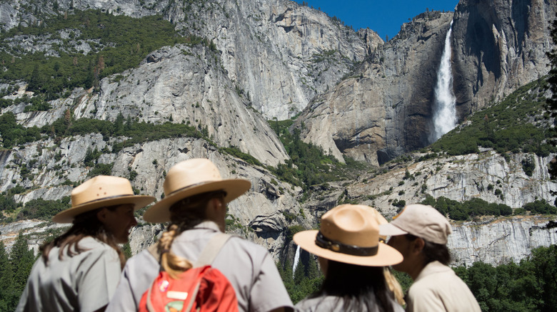 Park rangers in front of Yosemite Falls in Yosemite National Park in California
